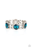 Paparazzi Devoted to Drama - Blue - Bracelet  -  Featuring edgy chain-like fittings, a sparkly series of oversized blue rhinestones are threaded along stretchy bands around the wrist for a dramatic pop of glitz.
