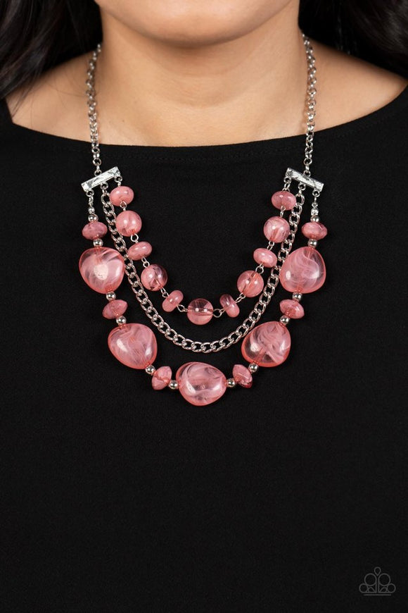 Paparazzi Oceanside Service - Pink - Necklace  -  A single silver chain separates two mismatched rows of oversized and cloudy glass-like pink beads. The colorful rows are held in place with textured silver fittings, creating an ethereal pop of color below the collar. Features an adjustable clasp closure.
