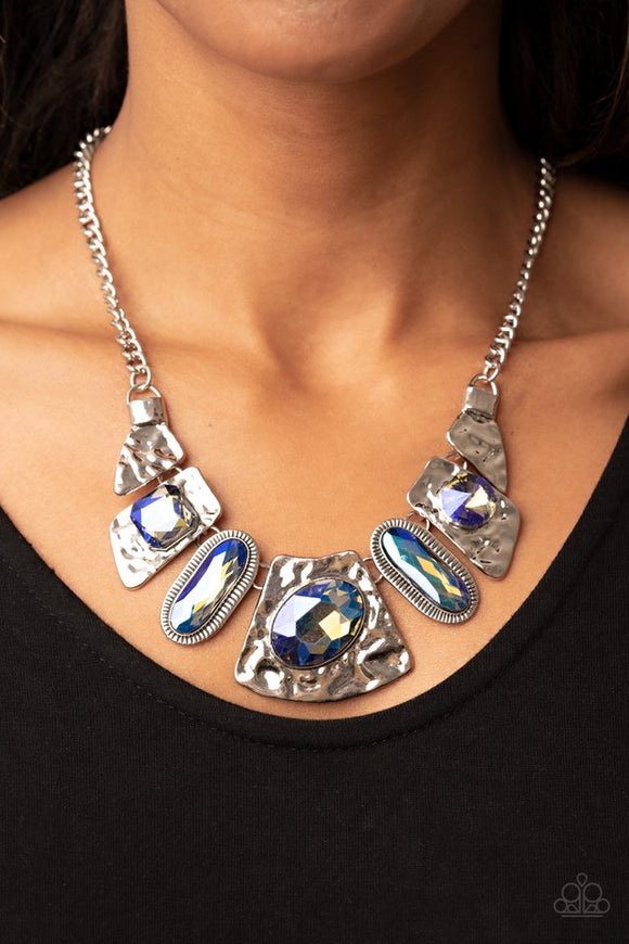 Paparazzi Futuristic Fashionista - Multi - Necklace  -  Featuring a stellar UV shimmer, mismatched iridescent multicolored gems adorn the front of hammered silver plates that abstractly connect below the collar for an out-of-this-world sparkle. Features an adjustable clasp closure.
