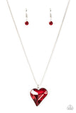 Paparazzi Lockdown My Heart - Red - Necklace  -  A shimmering red heart-shaped gem is pressed into a simple silver frame at the end of a silver box chain creating an adorable sentiment below the collar. Features an adjustable clasp closure.
