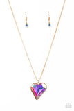 Paparazzi Lockdown My Heart - Gold - Necklace  -  An iridescent heart-shaped gem is pressed into a simple gold frame at the end of a gold box chain creating an adorable sentiment below the collar. Features an adjustable clasp closure.
