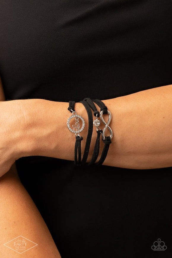 Paparazzi I Will Always Love You - Black - Bracelet  -  A single rhinestone, an infinity charm, and a silver hoop encrusted in dazzling white rhinestones featuring the word “Love” attach to strands of soft black suede in an effortlessly layered display. Features an adjustable clasp closure.