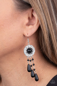 Paparazzi Dreams Can Come True - Black - Earrings
Black beaded tassels taper from the bottom of a black beaded and white rhinestone encrusted floral frame, creating a refined dream catcher inspired frame. Earring attaches to a standard fishhook fitting.