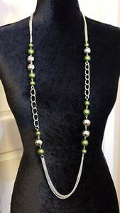 Paparazzi Uptown Talker - Green Varying in size, pearly green and oversized silver beads give way to sections of bold silver chain. Layers of silver chains drape across the bottom of the design for a flawless finish. Features an adjustable clasp closure. 