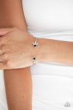 Paparazzi A Bit Rich - Black - Bracelet
Featuring regal hematite and black rhinestone encrusted fittings, a dainty silver cuff curls around the wrist for a refined look. 