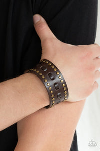 Paparazzi A ROAM With A View - Brown - Bracelet
Brown laces are threaded through the center of a brown leather band that has been studded in brass accents, creating a rustic centerpiece around the wrist. Features an adjustable snap closure.
