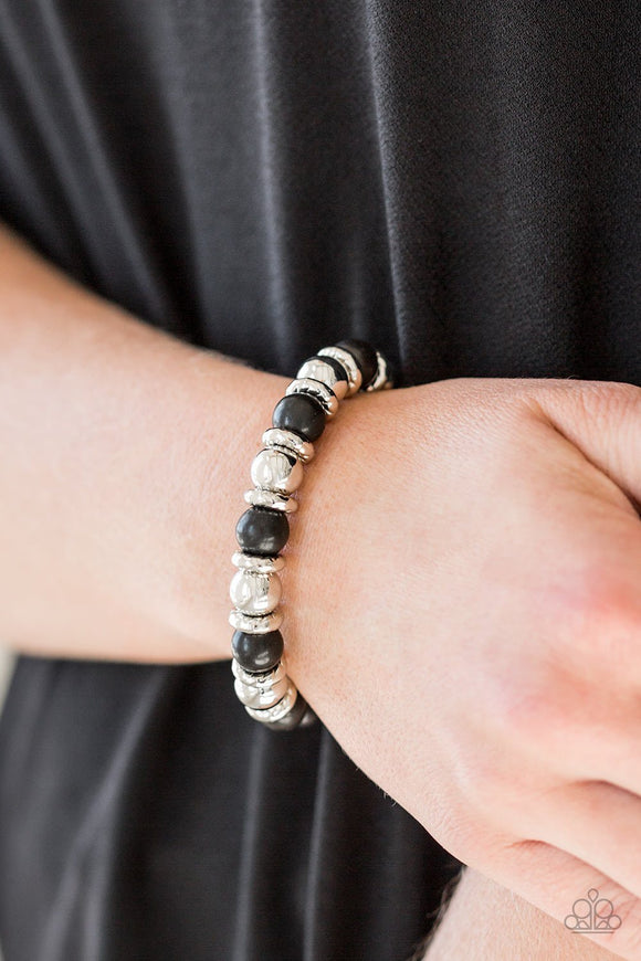 Paparazzi Across The Mesa - Black - Bracelet
A collection of silver accents and earthy black stones are threaded along a stretchy band for a seasonal look.
