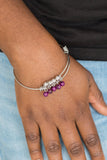 Paparazzi All Roads Lead To ROAM - Purple - Bracelet
Silver wire coils around the wrist, creating an adjustable-like bangle. Glassy purple beads slide between two wire wrap fittings, creating colorful accents along the wrist.
