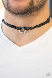 Paparazzi Basic Backpacker - Black - Necklace
Braided black cording knots around black lava rocks and a faceted silver ring for a seasonal look. Features a button loop closure. 
