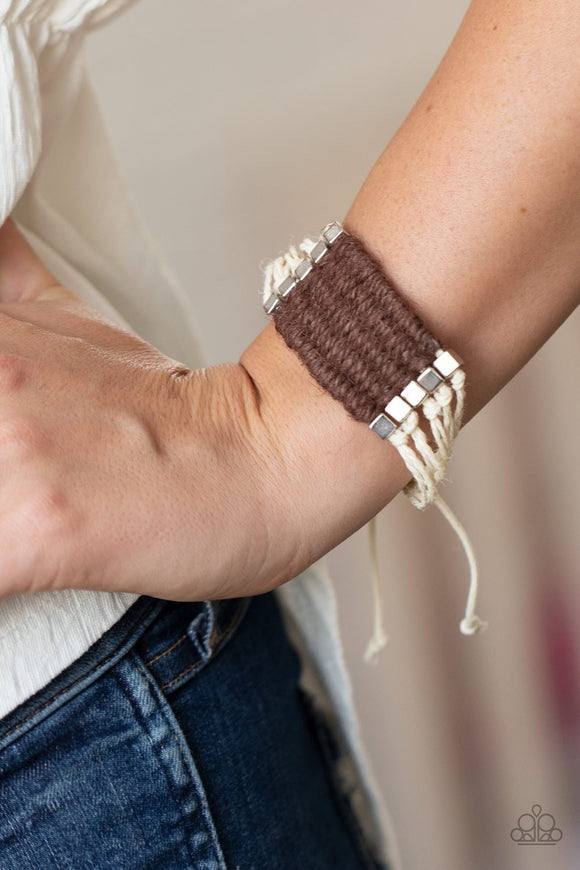 Paparazzi Beachology - Brown - Bracelet
Infused with silver cube beads, brown twine-like cording knots and weaves around strands of white cording, creating a colorful centerpiece. Features an adjustable sliding knot closure.
