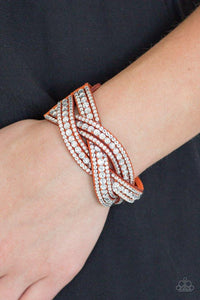 Paparazzi Bring On The Bling - Orange - Bracelet
Varying in size, glassy white rhinestones are encrusted along interwoven orange suede bands, creating blinding shimmer across the wrist. Features an adjustable snap closure. 