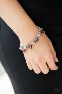 Paparazzi Catwalk Crawl - Purple - Bracelet
Featuring crystal-like and metallic opaque finishes, mismatched purple and gray beading swings from a shimmery silver chain, creating a glamorous fringe around the wrist. Features an adjustable clasp closure. 
