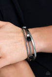 Paparazzi City Slicker Sleek - Black - Bracelet
Brushed in an antiqued shimmer, a collection of smooth and textured silver bangles stack across the wrist. Varying in shape and size, glittery black and white rhinestones are encrusted along one bangle for a glamorous glow.
