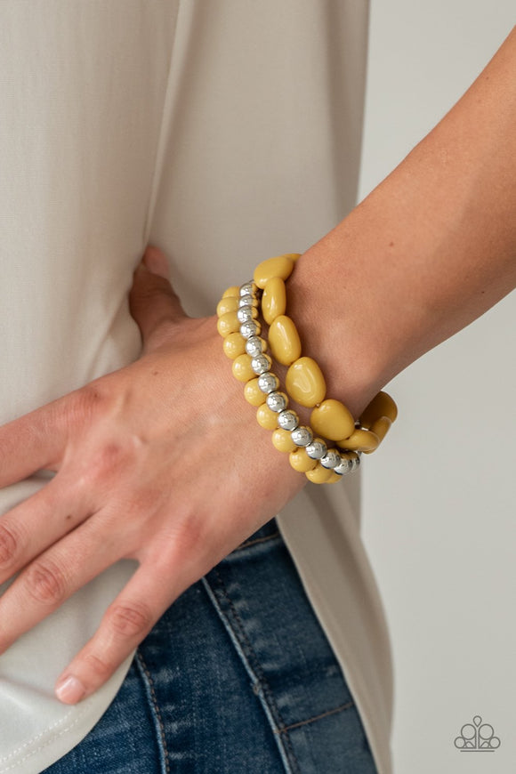 Paparazzi Color Venture - Yellow - Bracelet
Varying in size, yellow and silver beads are threaded along stretchy bands, creating colorful layers across the wrist.
