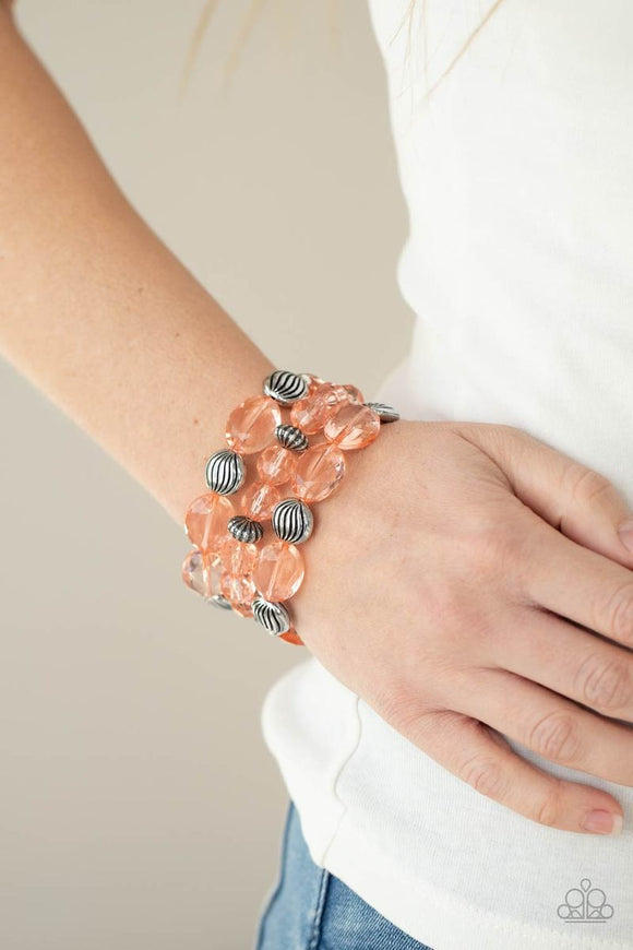 Paparazzi Crystal Charisma - Orange Coral - Bracelet
A mismatched collection of sparkly Burnt Coral crystal-like beads and textured silver accents are threaded along stretchy bands around the wrist, creating glamorous layers.
