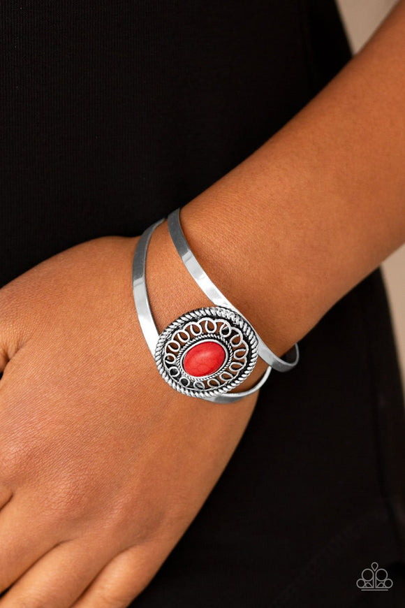 Paparazzi Deep In The TUMBLEWEEDS - Red - Bracelet
Featuring a fiery red stone center, an ornate silver frame sits atop an airy silver cuff for a seasonal look.
