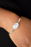 Paparazzi Definitely Dashing - White - Bracelet
Arcing silver bars connect to a faceted white gem centerpiece, creating a dainty cuff-like bracelet around the wrist. Features an adjustable clasp closure.
