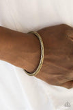 Paparazzi Desert Charmer - Brass - Bracelet
Stamped in a scalloped pattern, a glistening brass cuff wraps around the wrist for a tribal inspired look. 