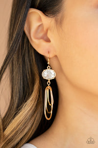 Paparazzi Drop-Dead Glamorous - Gold - Earrings
Oval shaped gold frames drip from the bottom of an oversized white rhinestone gem, creating a rippling fringe. Earring attaches to a standard fishhook fitting.