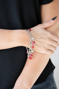 Paparazzi Fancy Fascination - Red - Bracelet
Featuring pearly and glassy finishes, an array of silver and red beads swing from a double-linked silver chain, creating a fancy fringe around the wrist. Features an adjustable clasp closure. 