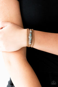 Paparazzi Find Your Way - Blue - Bracelet
An array of blue and silver beads are knotted in place along elongated suede cording for a wanderlust fashion. To secure bracelet, tie ends in place around the wrist at desired length.
