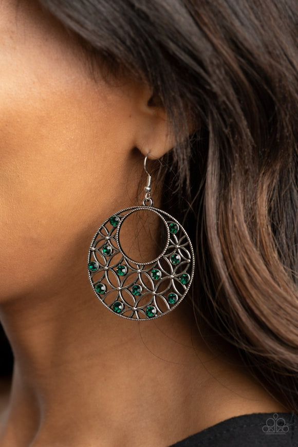 Paparazzi Garden Garnish - Green - Earrings
Dotted with glittery green rhinestones, an airy backdrop of antiqued flowers climb a studded silver hoop for a whimsical look. Earring attaches to a standard fishhook fitting.
