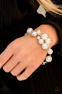 Paparazzi Girls In Pearls - White - Bracelet
Clusters of white pearls swing from a silver chain, creating a fabulous fringe that wraps elegantly around the wrist. Features an adjustable clasp closure.
