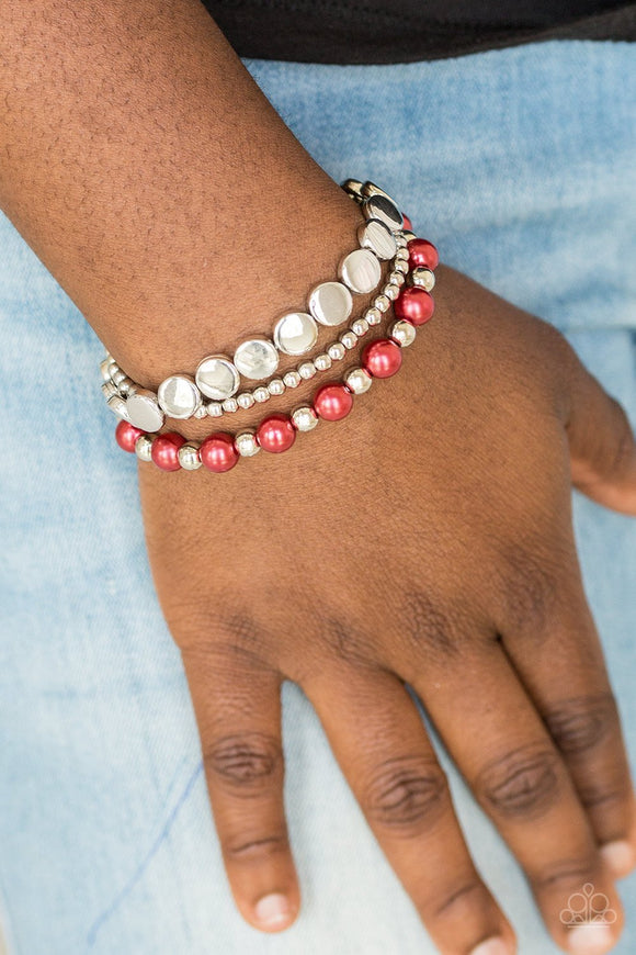 Paparazzi Girly Girl Glamour - Red - Bracelet
Mismatched silver and pearly red beads are threaded along stretchy elastic bands, creating colorful layers across the wrist.
