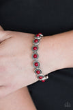 Paparazzi Globetrotter Goals - Red - Bracelet
Dotted with robust red beaded centers, studded silver frames are threaded along stretchy elastic bands and linked around the wrist for a whimsical look.
