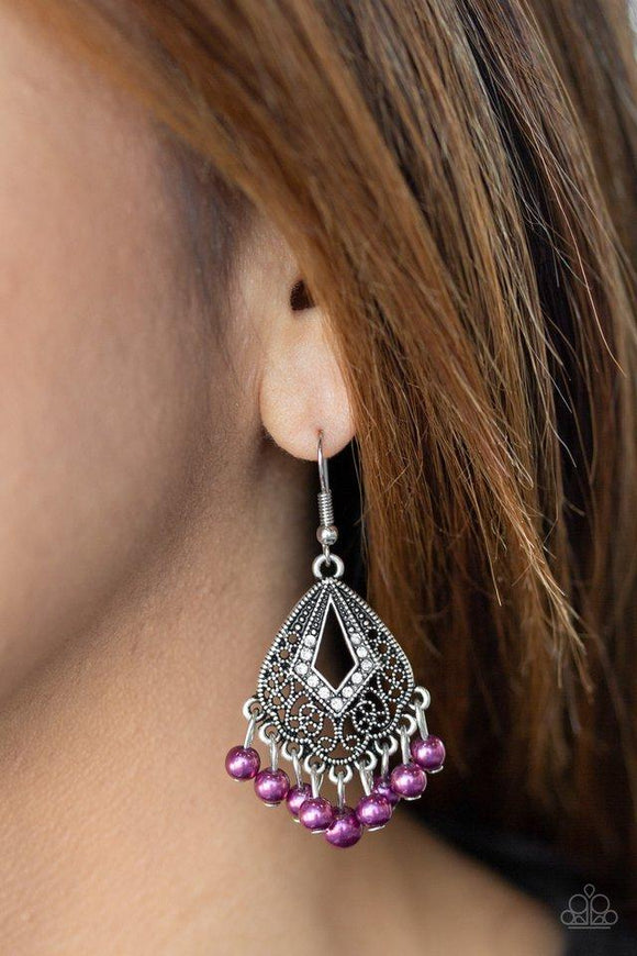 Paparazzi Gracefully Gatsby - Purple - Earrings
A pearly purple fringe swings from the bottom of an ornate silver frame radiating with glassy white rhinestones for a refined look. Earring attaches to a standard fishhook fitting.All jewelry is Lead & Nickel Free!