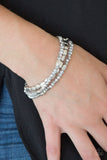 Paparazzi Hello Beautiful - Silver - Bracelet
Infused with hints of silver, dainty smoky and metallic crystal-like beads are threaded along stretchy bands, creating whimsical layers across the wrist.
