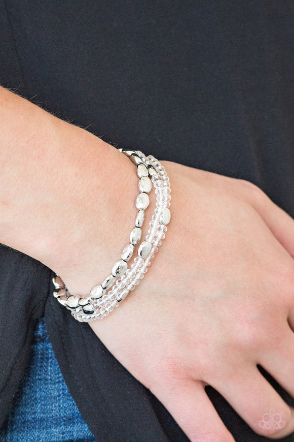 Paparazzi Hello Beautiful - White - Bracelet
Infused with hints of silver, dainty white crystal-like beads are threaded along stretchy bands, creating whimsical layers across the wrist.
