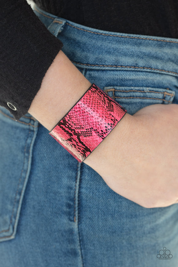 Paparazzi Its a Jungle Out There - Pink - Bracelet
Featuring neon pink python print, a thick leather band wraps around the wrist for a colorfully wild look. Features an adjustable snap closure.