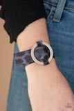 Paparazzi Jungle Cat Couture - Purple - Bracelet
Featuring a shiny purple cheetah pattern, a textured piece of leather loops through the center of a shimmery silver hoop for a sassy urban look. Features an adjustable belt loop closure.