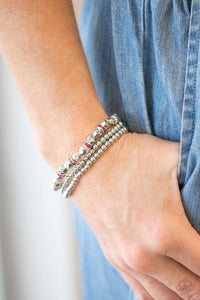 Paparazzi Let There BEAM Light - Pink - Bracelet
Infused with pink rhinestone encrusted rings, mismatched dainty silver and faceted silver beads are threaded along stretchy bands for a refined look.

All jewelry is Lead &amp; Nickel Free!