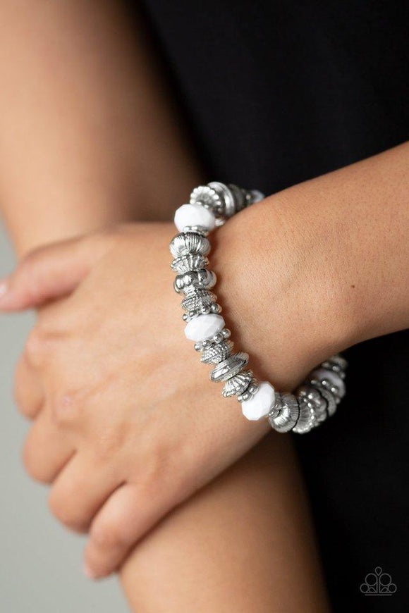  
Paparazzi Live Life To The COLOR-Fullest - White - Bracelet
A collection of faceted white beads, ornate silver beads, and studded silver rings are threaded along a stretchy band around the wrist for a colorfully refined look. 
