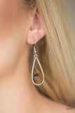 Paparazzi Over The Moon - Brown - Earrings
A glowing brown moonstone is nestled inside the bottom of an airy silver teardrop frame for a whimsical look. Earring attaches to a standard fishhook fitting.

Always nickel and lead free.