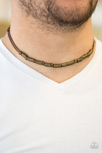 Paparazzi PIRATE First Class - Brown - Necklace
Decorative brass beads are knotted in place along a shiny brown cord below the collar for a seasonal look. Features a button loop closure.
