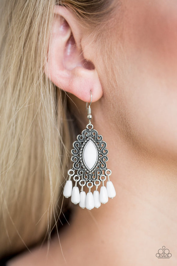 Paparazzi Private Villa - White - Earrings
A faceted white bead is pressed into the center of a studded silver frame radiating with antiqued filigree. Matching white beads swing from the bottom of the frame, creating a whimsical fringe. Earring attaches to a standard fishhook fitting.
