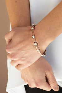 Paparazzi Rebel Sandstorm - Copper - Bracelet
Dotted with dainty white stones, a hammered copper bangle glides along the wrist for a colorfully earthy look.