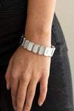 Paparazzi Retro Effect - Silver - Bracelet
Brushed in an antiqued shimmer, burnished silver rectangular frames are threaded along stretchy bands around the wrist for a rustic look.

