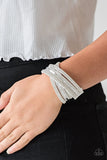 Paparazzi Rock Star Attitude - White - Bracelet
Encrusted in rows of glassy white rhinestones and flat silver studs, three strands of white suede wrap around the wrist for a sassy look. The elongated band allows for a trendy double wrap around the wrist. Features an adjustable snap closure.
