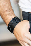 Paparazzi Rodeo Rampage - Black - Bracelet
Rustic strips of leather are laced through a thick black leather band, creating a rustic look around the wrist. Features an adjustable snap closure. 