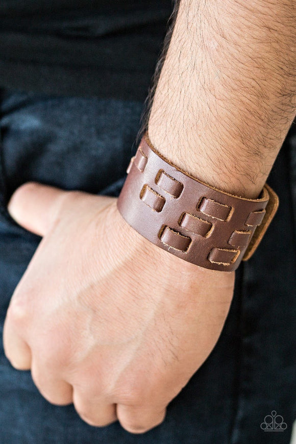 Paparazzi Rodeo Rampage - Brown - Bracelet
Rustic strips of leather are laced through a thick brown leather band, creating a rustic look around the wrist. Features an adjustable snap closure.
