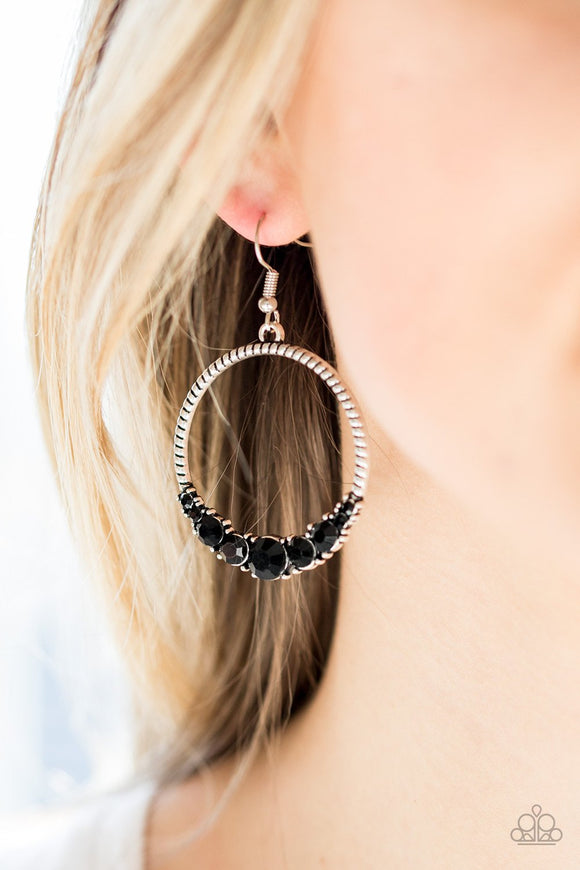 Paparazzi Self-Made Millionaire - Black - Earrings
The bottom of a textured silver hoop is encrusted in glittery black rhinestones for a glamorous look. Earring attaches to a standard fishhook fitting.
