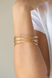 Paparazzi Showstopping Sheen - Gold - Bracelet
A collection of glistening gold bangles join into an abstractly layered cuff around the wrist for a casual glam. 
