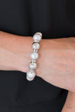 Paparazzi So Not Sorry - Silver - Bracelet
A collection of white rhinestone encrusted rings, silver pearls, and classic silver beads are threaded along a stretchy band around the wrist for a glamorous look.
