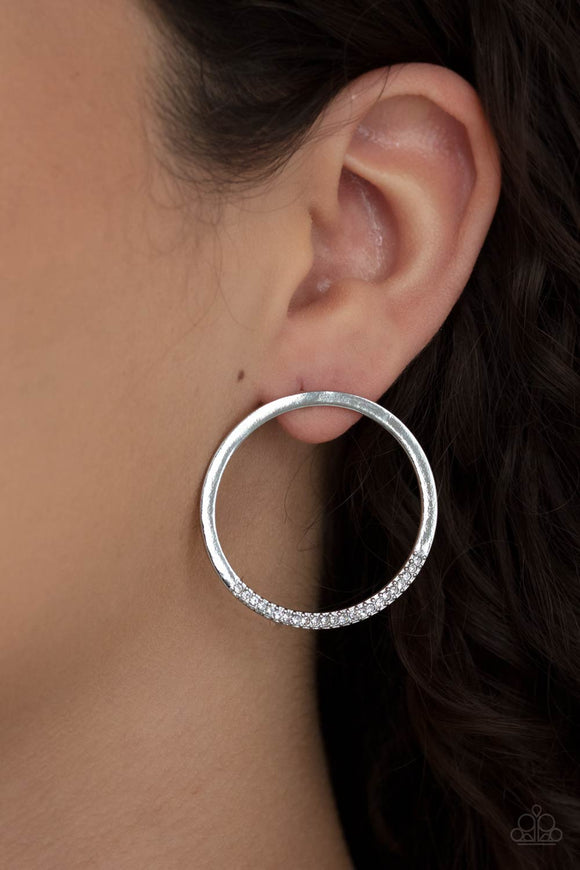 Paparazzi Spot On Opulence - White - Earrings
As if dipped in glitter, the bottom of a flat silver hoop is encrusted in dainty white rhinestones for a classic shimmer. Earring attaches to a standard post fitting.
