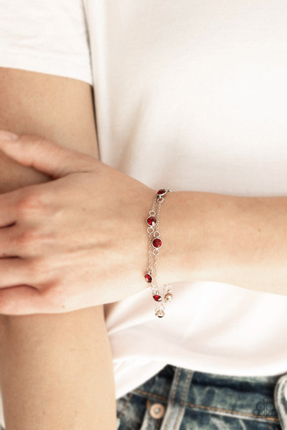 Paparazzi Spotlight Starlight - Red - Bracelet
Featuring sleek silver frames, glittery red rhinestones trickle along glistening silver chains around the wrist for a refined fashion. Features an adjustable clasp closure.
