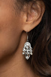 Paparazzi Stunning Starlet - White - Earrings
Featuring regal marquise, teardrop, and oval cuts, a sparkly collection of glassy white rhinestones adorn a glittery backdrop of glassy white rhinestones, creating a dramatically dazzling centerpiece. Earring attaches to a standard fishhook fitting.
